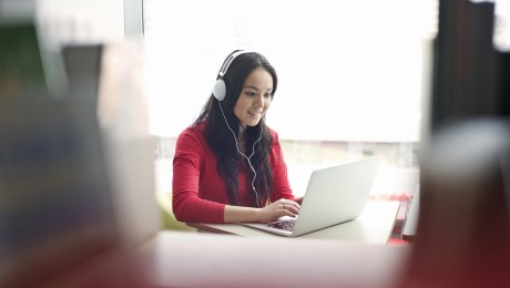 woman studying online on her laptop